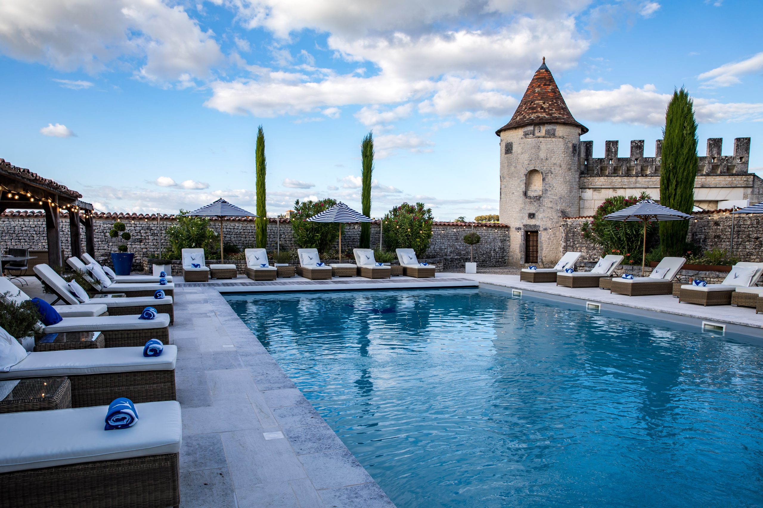 A 16th century tower anchors the pool